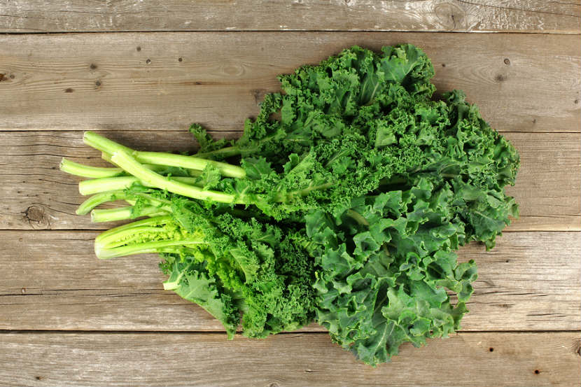 kale, wooden background
