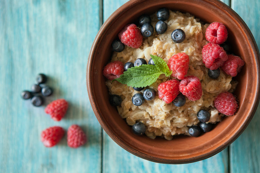 bowl of oatmeal with with berries in it