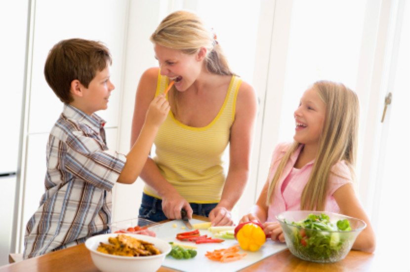 a mom and her son cooking in the kitchen