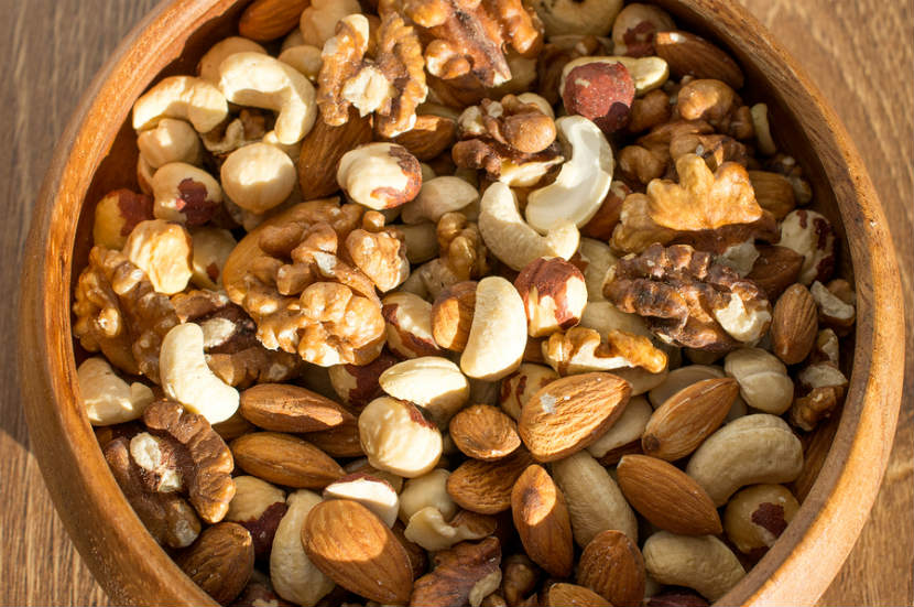 bowl of mixed tree nuts like cashews, walnuts, pecans and almonds