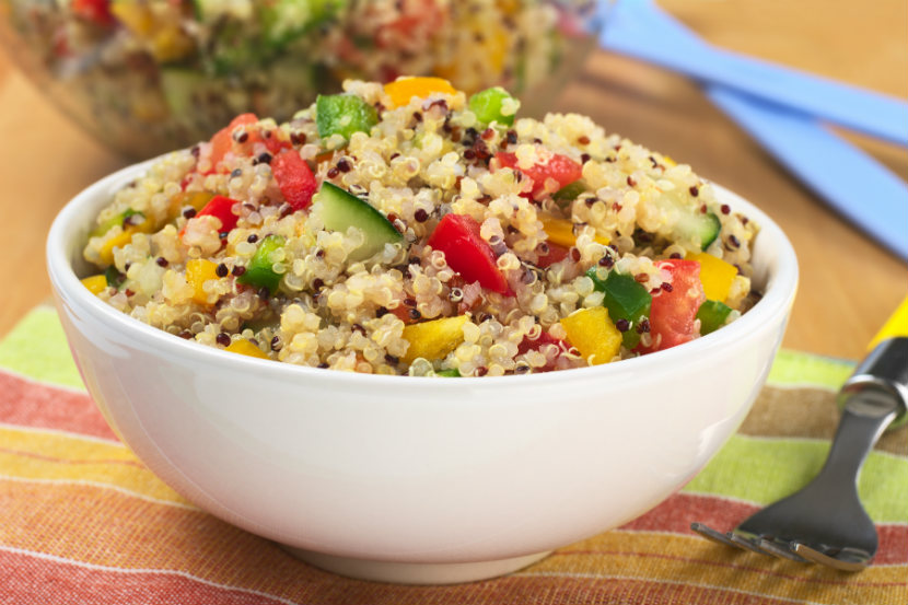 quinoa salad with peppers and cucumber in a bowl