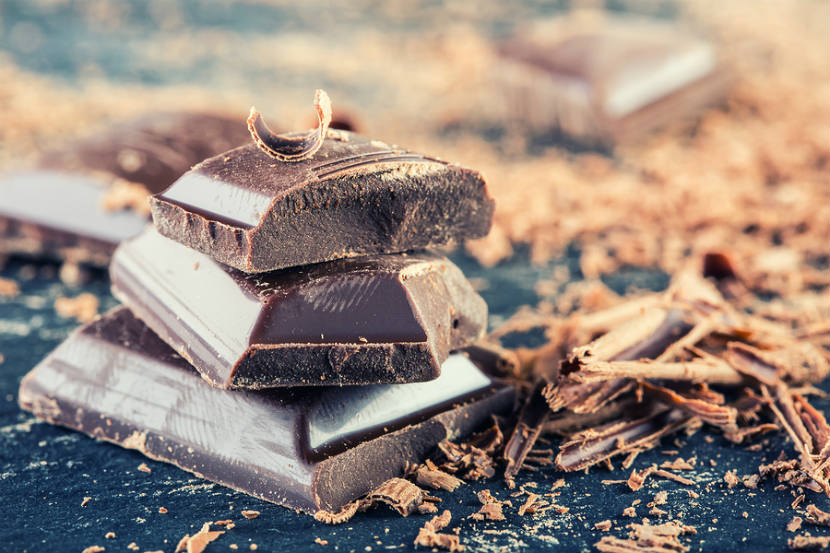 squares of dark chocolate and chocolate shavings