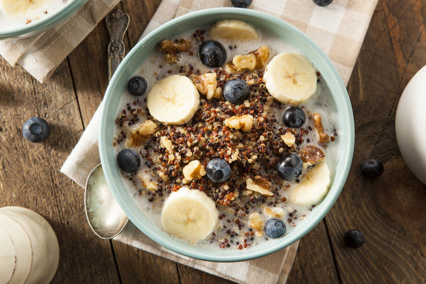 bowl of whole grain porridge with fruits and nuts