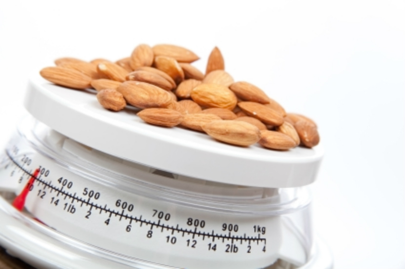 measuring almonds on a scale