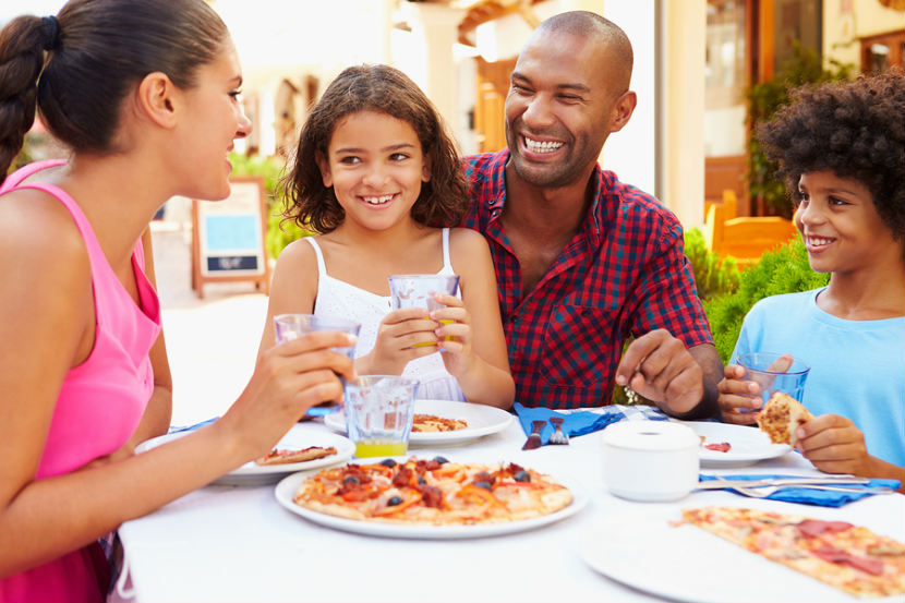 family eating pizza