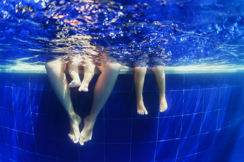 mom and kids in the swimming pool