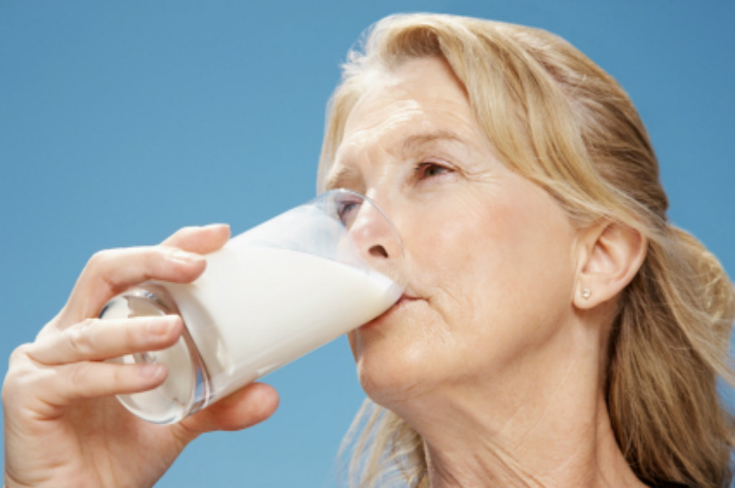 older adult drinking milk