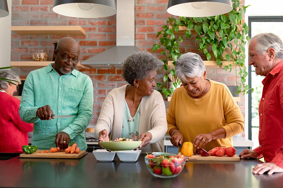 group of people cooking a healthy meal