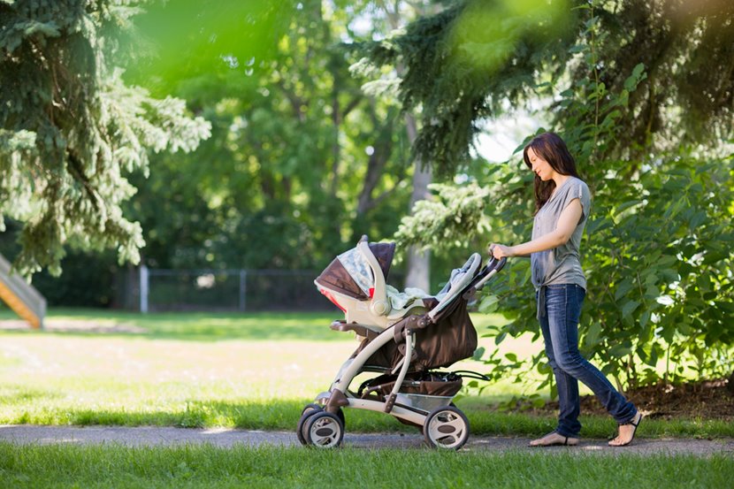 woman pushing stroller